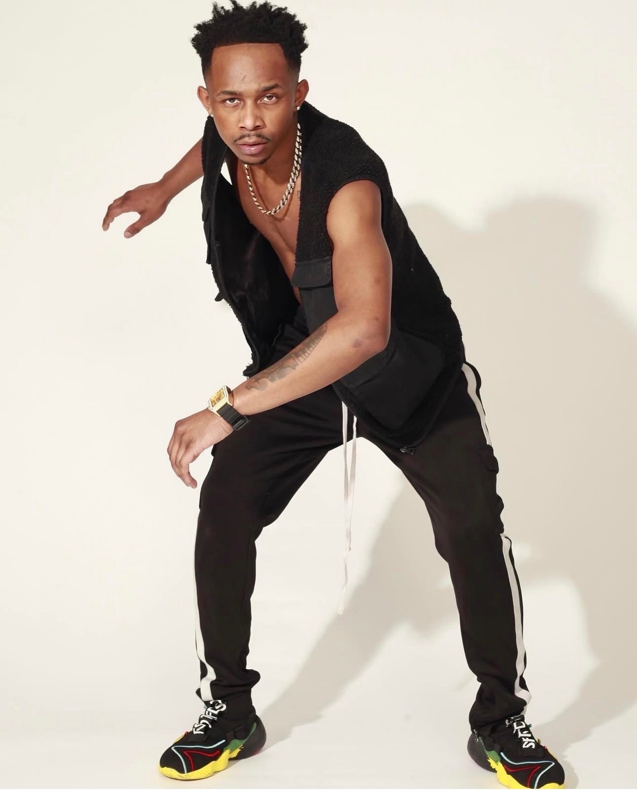 Nigel Teamer striking a dance pose